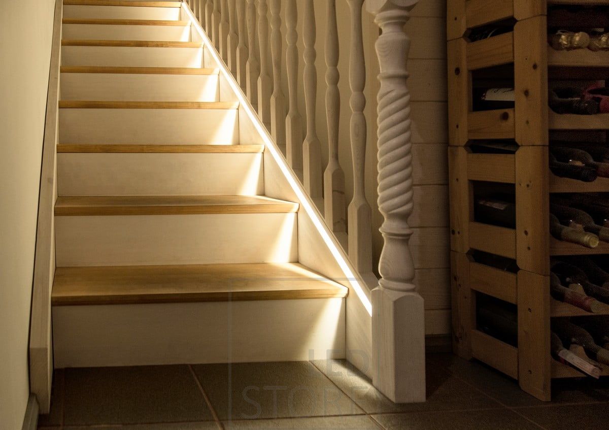 Led ribbon in a flush profile milled as close as possible to the steps.